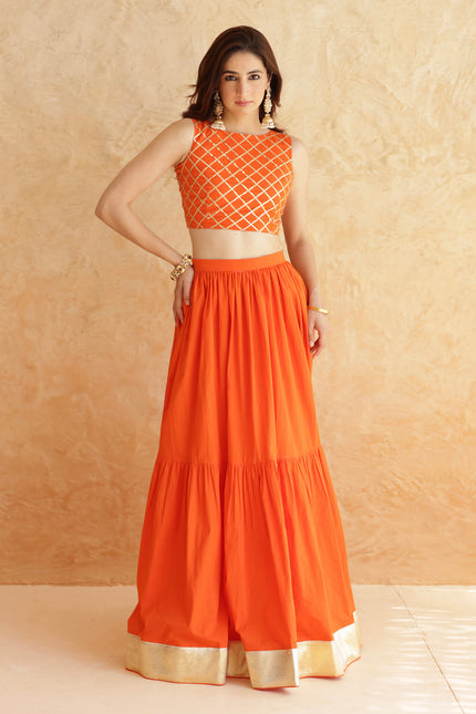 Bright orange lehenga + sleeveless blouse set