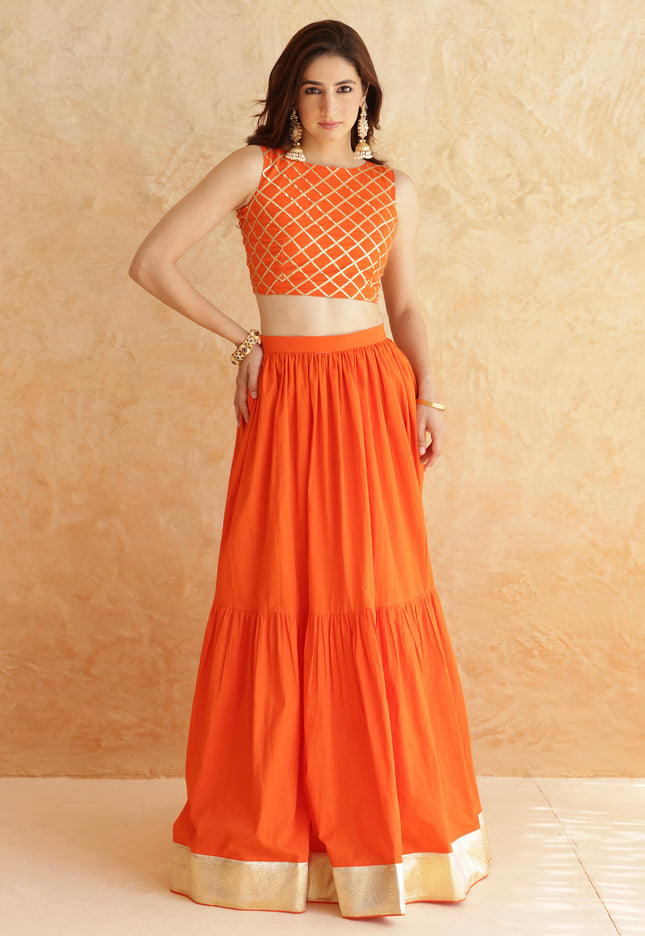 Bright orange lehenga + sleeveless blouse set
