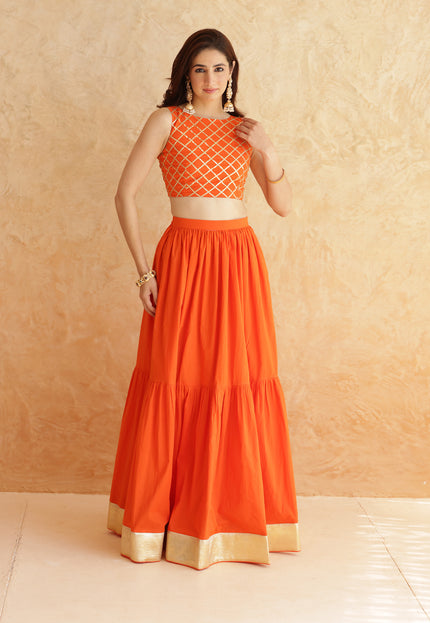 Bright orange lehenga + sleeveless blouse set