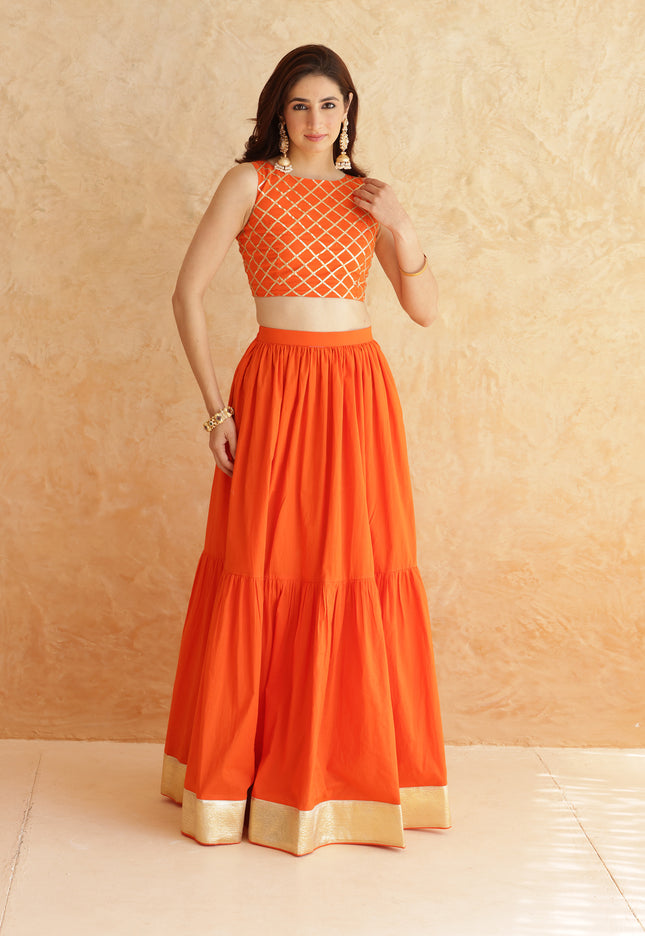 Bright orange lehenga + sleeveless blouse set