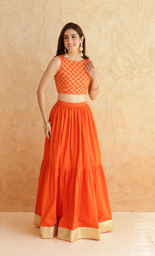 Bright orange lehenga + sleeveless blouse set
