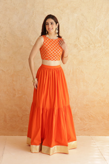 Bright orange lehenga + sleeveless blouse set