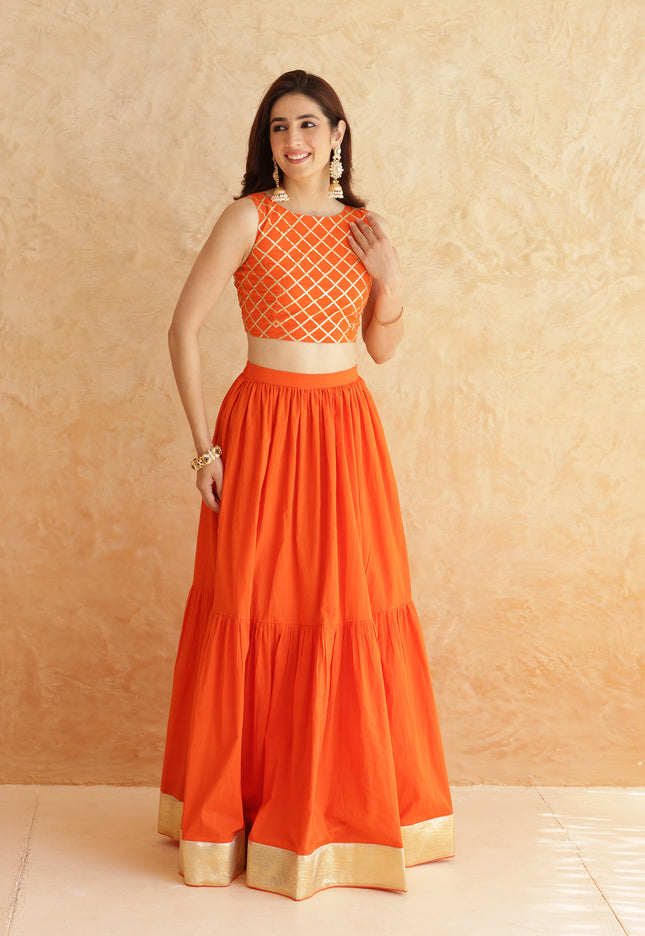 Bright orange lehenga + sleeveless blouse set