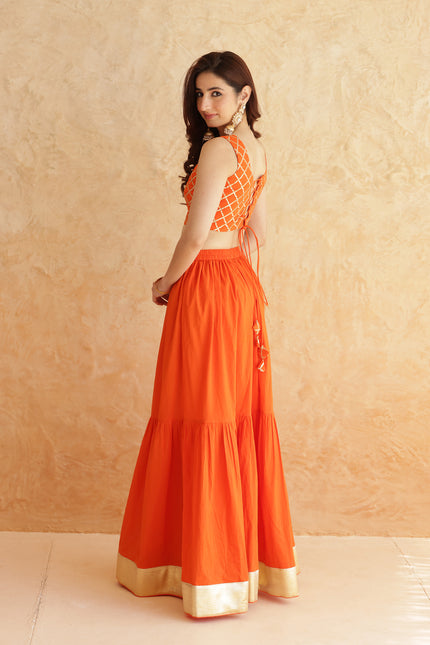 Bright orange lehenga + sleeveless blouse set