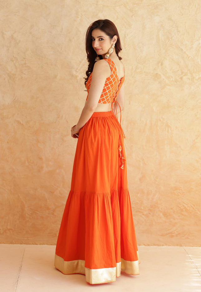 Bright orange lehenga + sleeveless blouse set