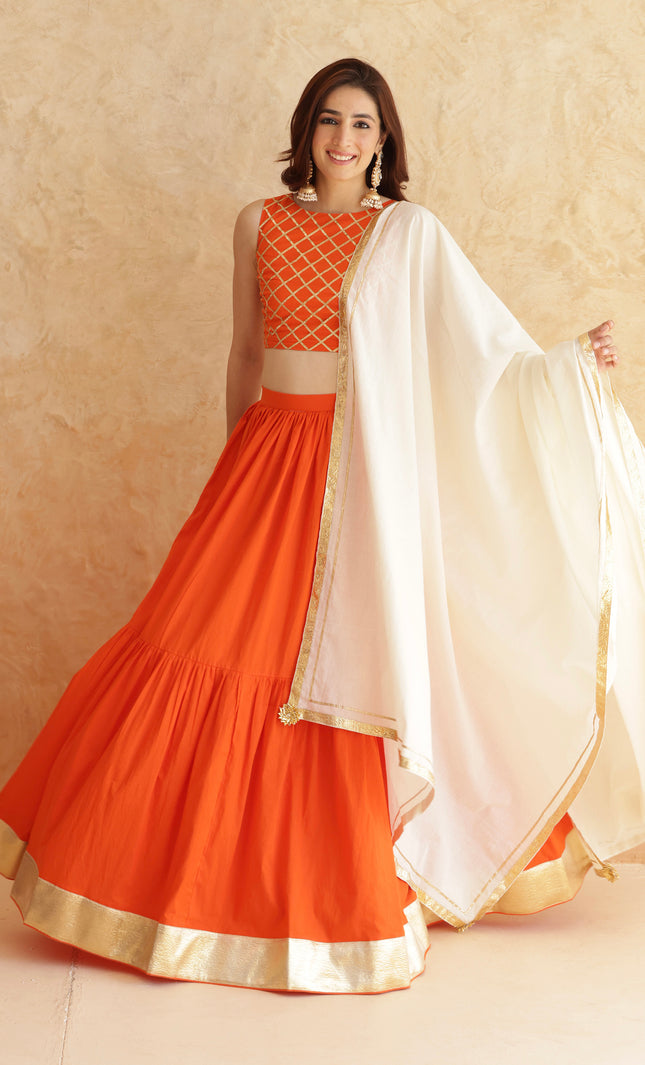 Bright orange lehenga + sleeveless blouse set