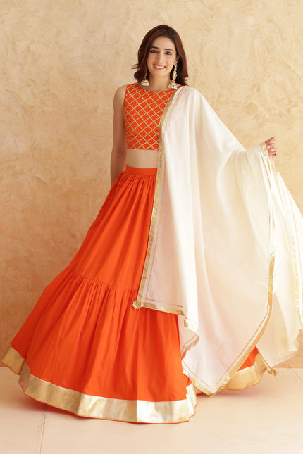 Bright orange lehenga + sleeveless blouse set