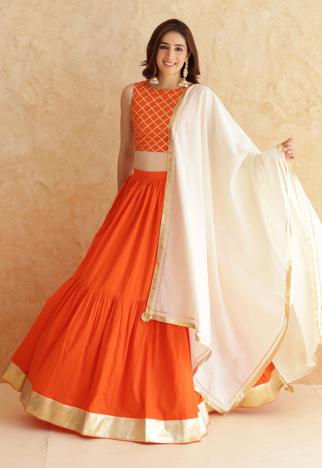 Bright orange lehenga + sleeveless blouse set