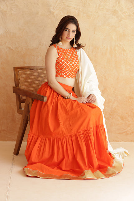 Bright orange lehenga + sleeveless blouse set