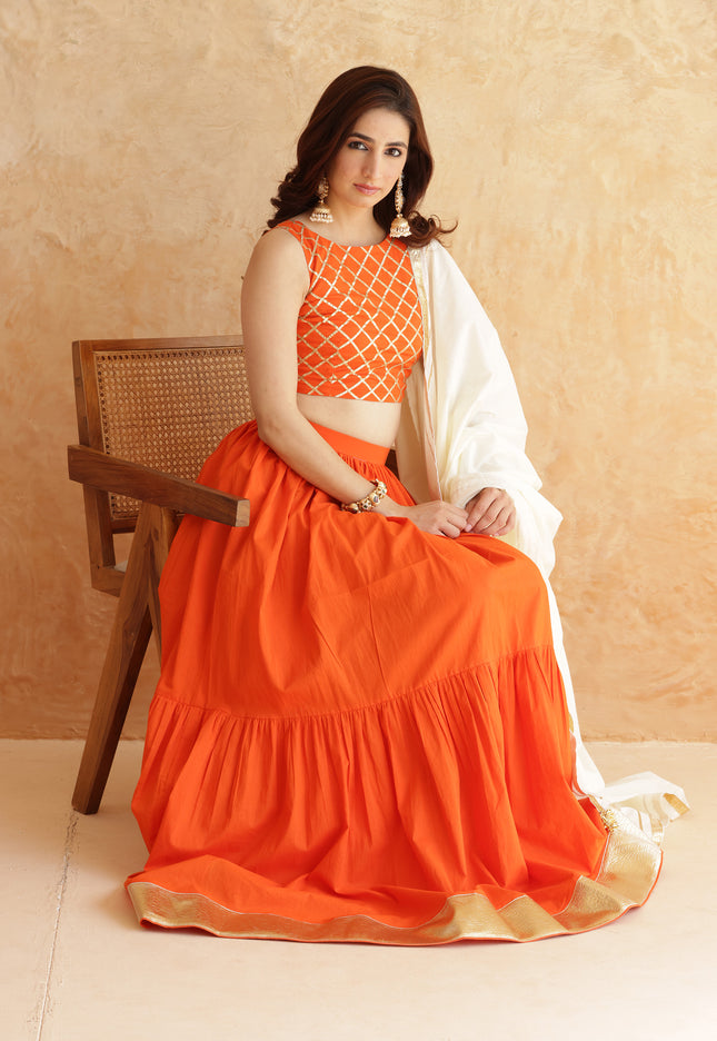 Bright orange lehenga + sleeveless blouse set