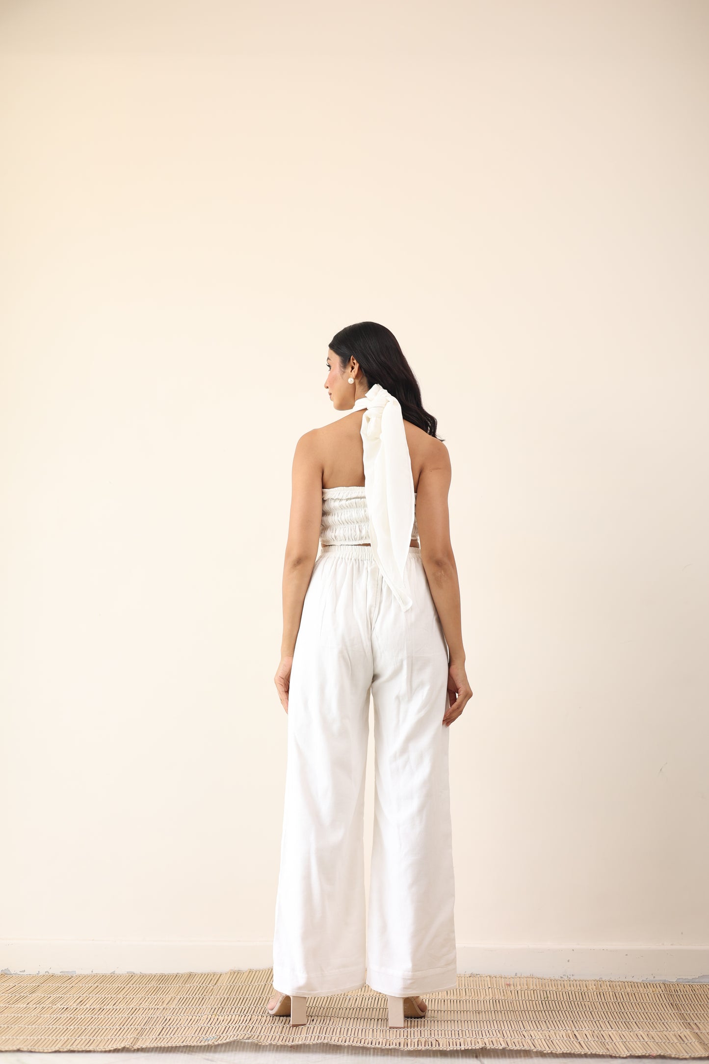 White high waist pants with tie up halter neck top