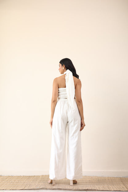 White high waist pants with tie up halter neck top