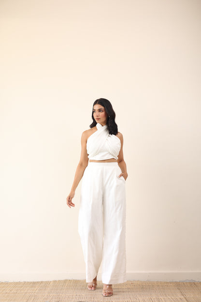 White high waist pants with tie up halter neck top