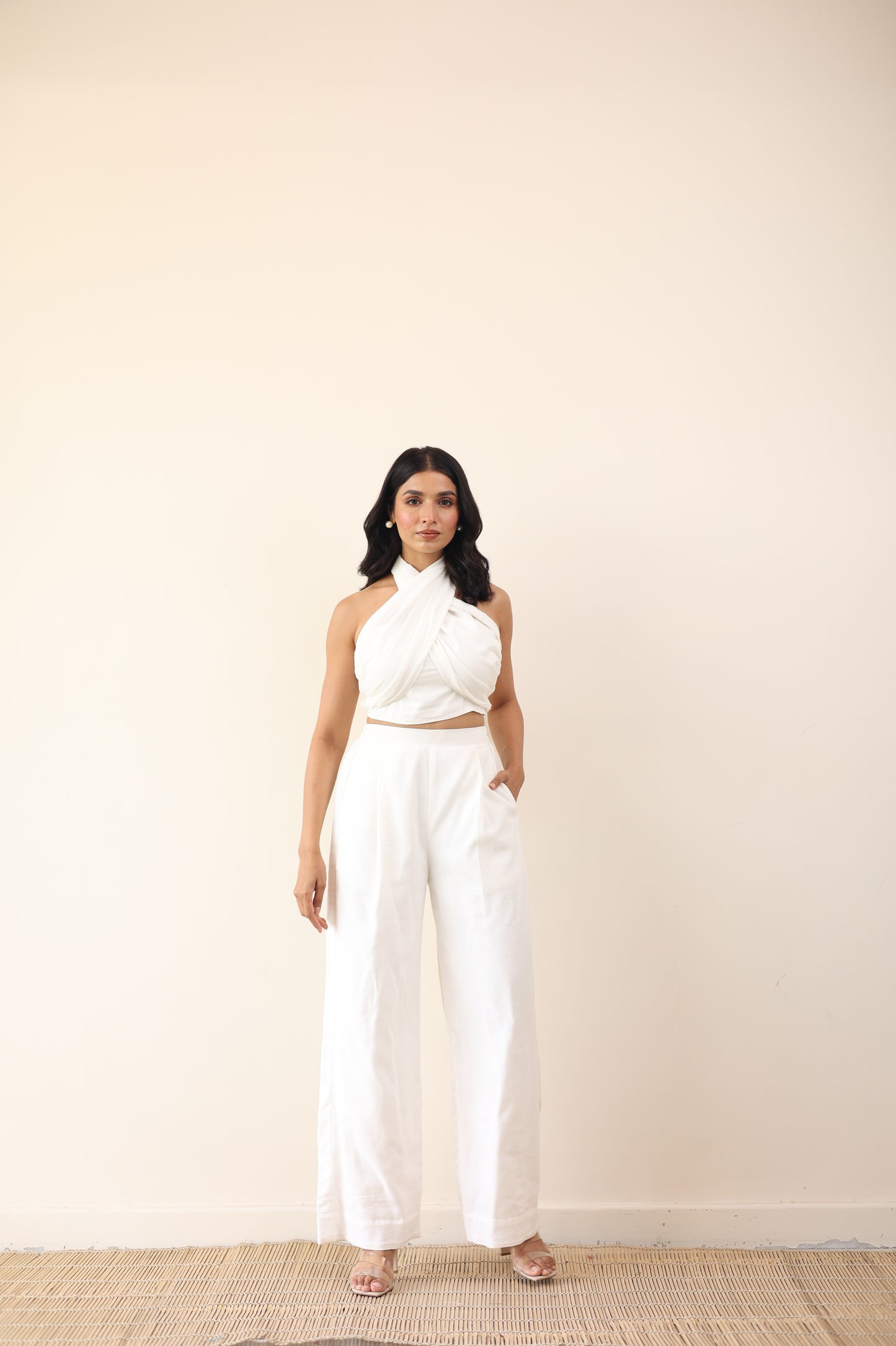 White high waist pants with tie up halter neck top