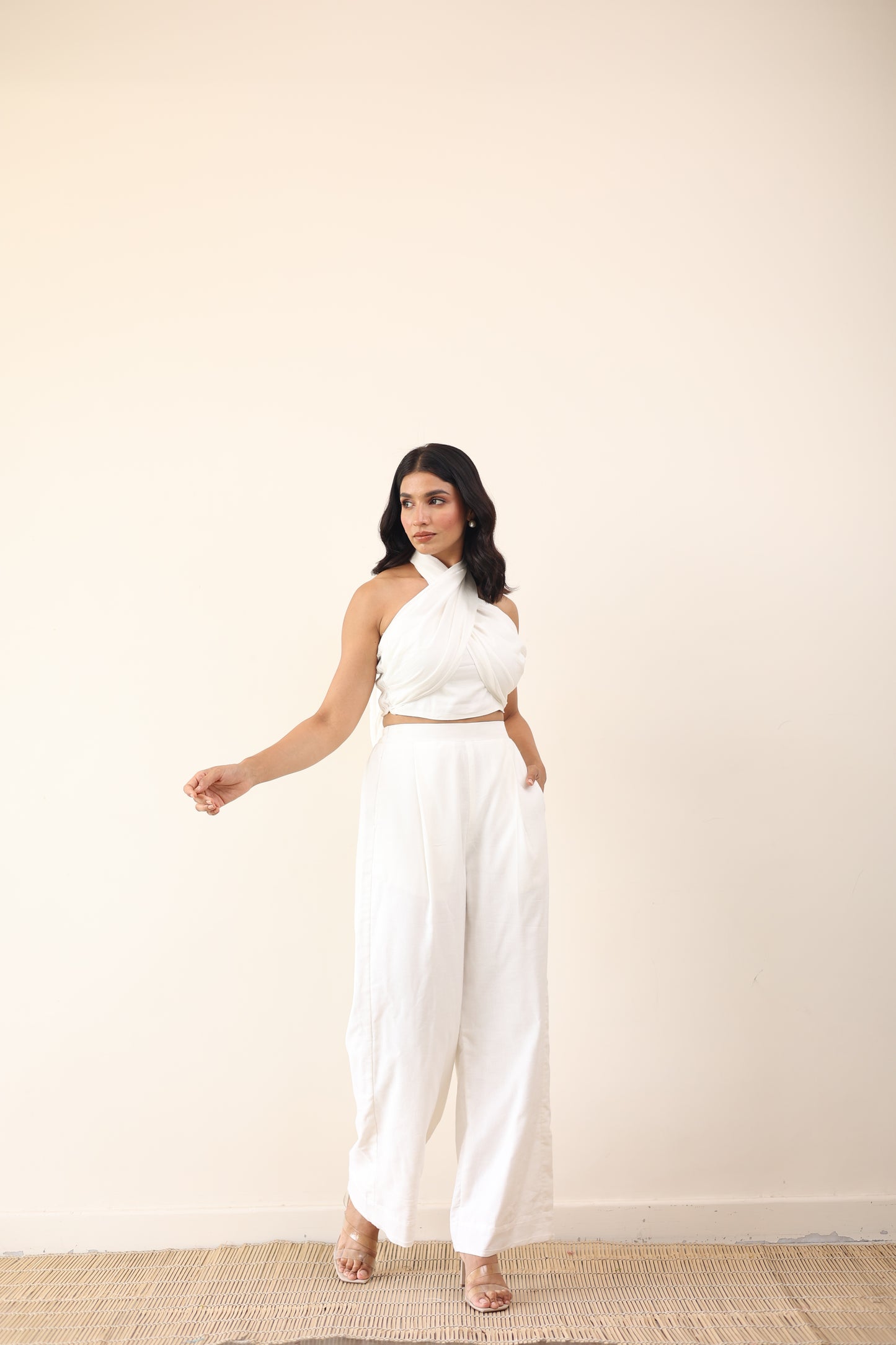 White high waist pants with tie up halter neck top