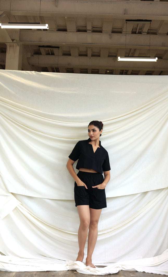 Black co-ord shorts and star neck top