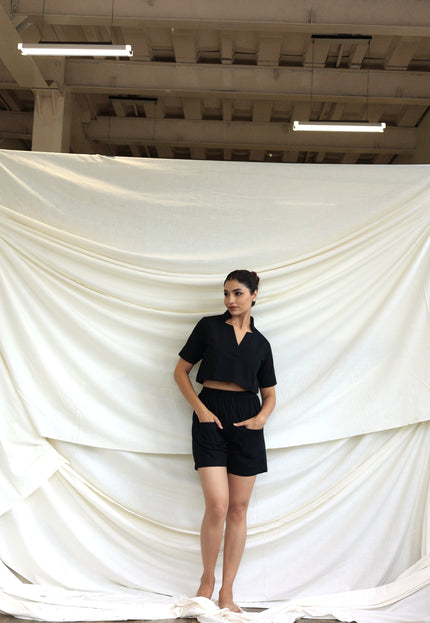 Black co-ord shorts and star neck top