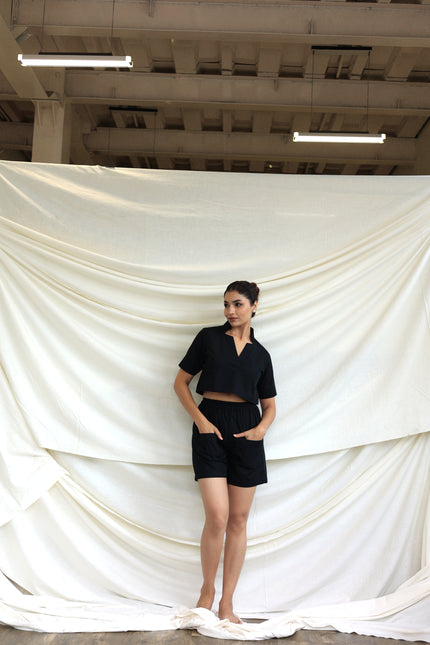 Black co-ord shorts and star neck top