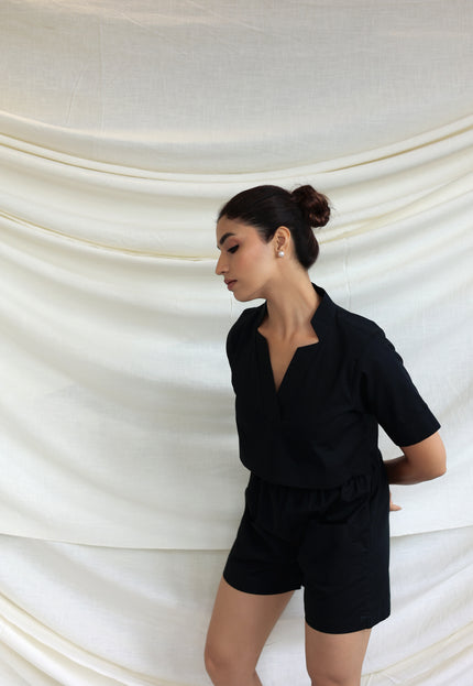 Black co-ord shorts and star neck top