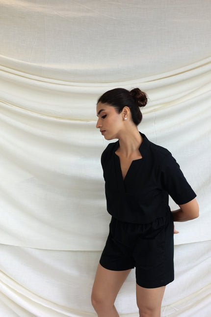 Black co-ord shorts and star neck top