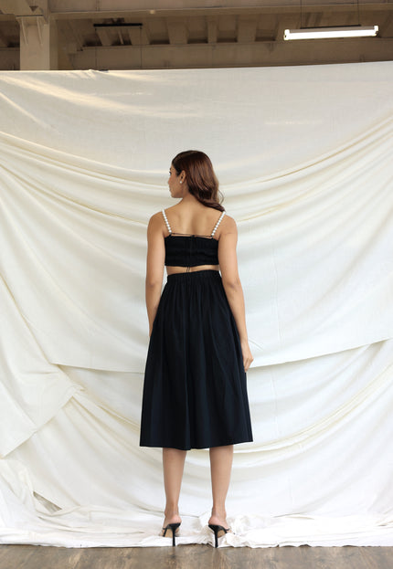 Black co-ord skirt and pearl bandeau top