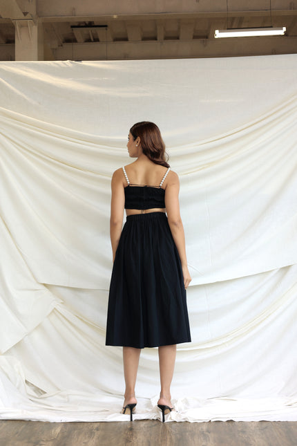 Black co-ord skirt and pearl bandeau top