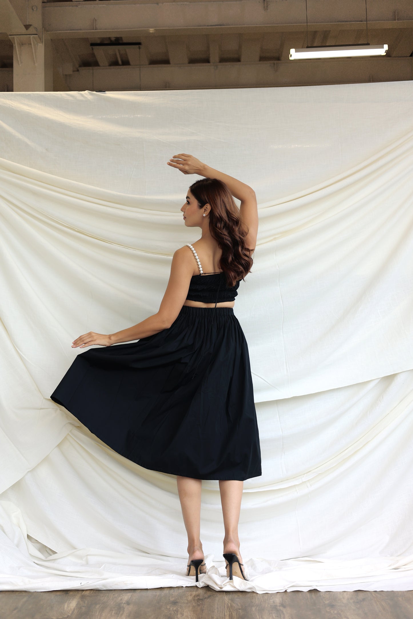Black co-ord skirt and pearl bandeau top