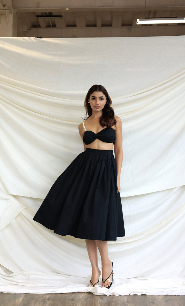 Black co-ord skirt and pearl bandeau top