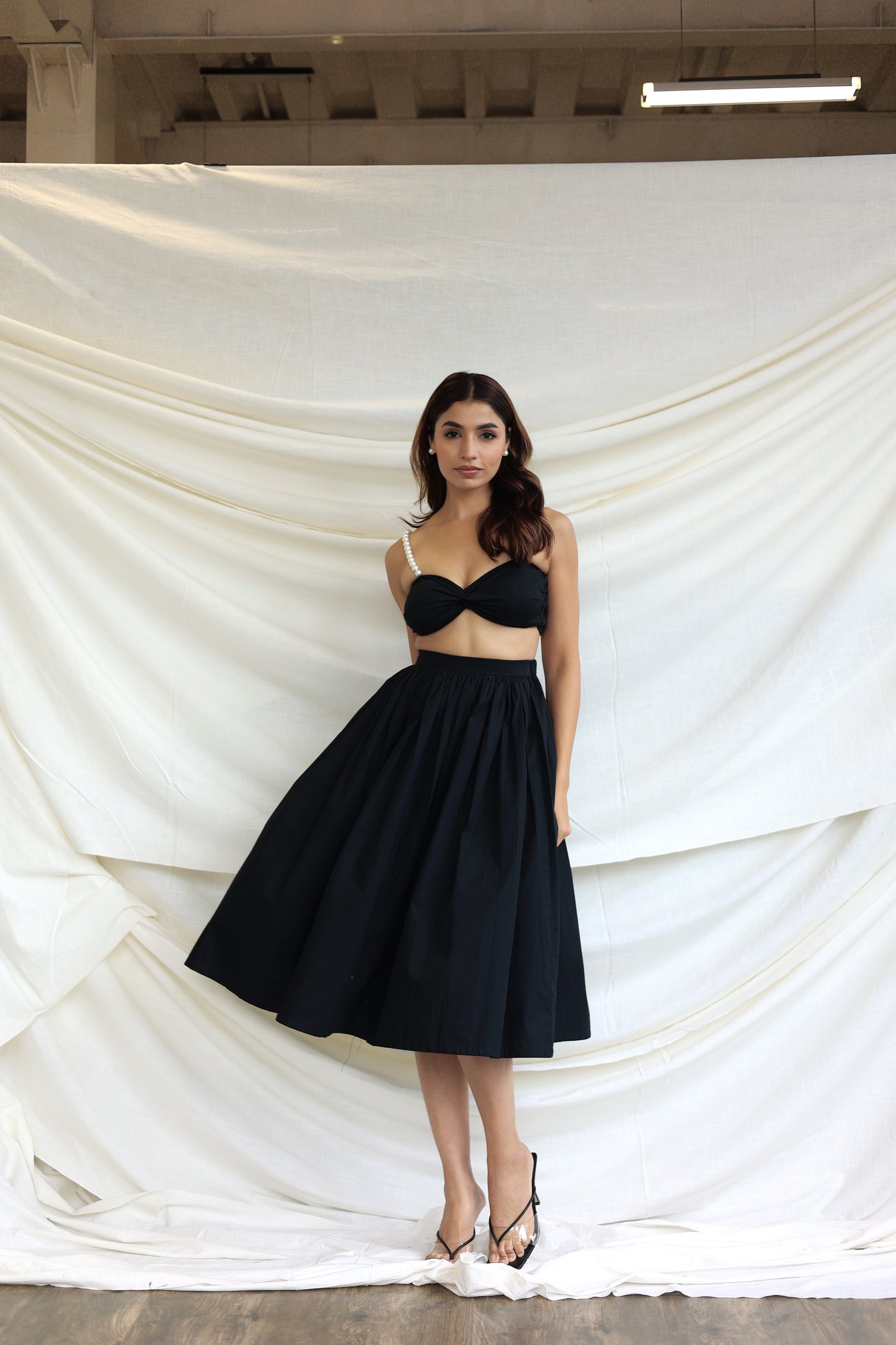 Black co-ord skirt and pearl bandeau top