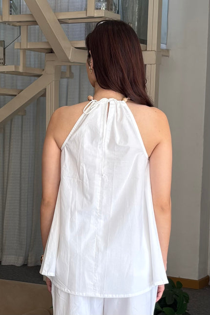 White wooden bead top