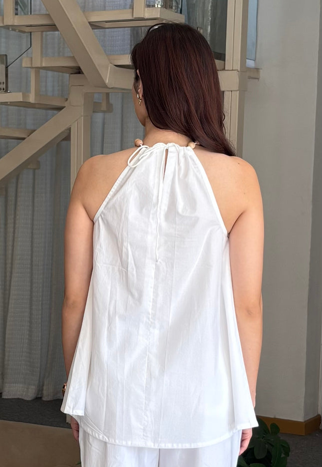 White wooden bead top