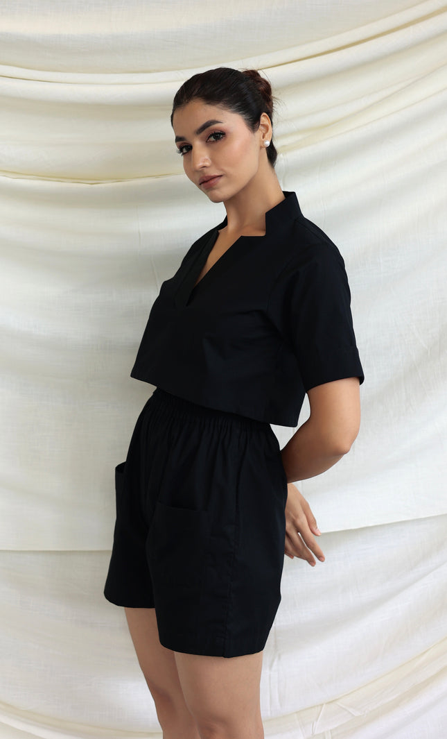 Black co-ord shorts and star neck top