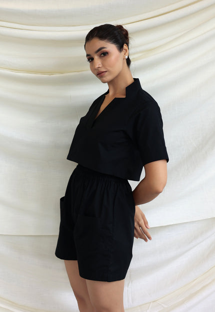 Black co-ord shorts and star neck top
