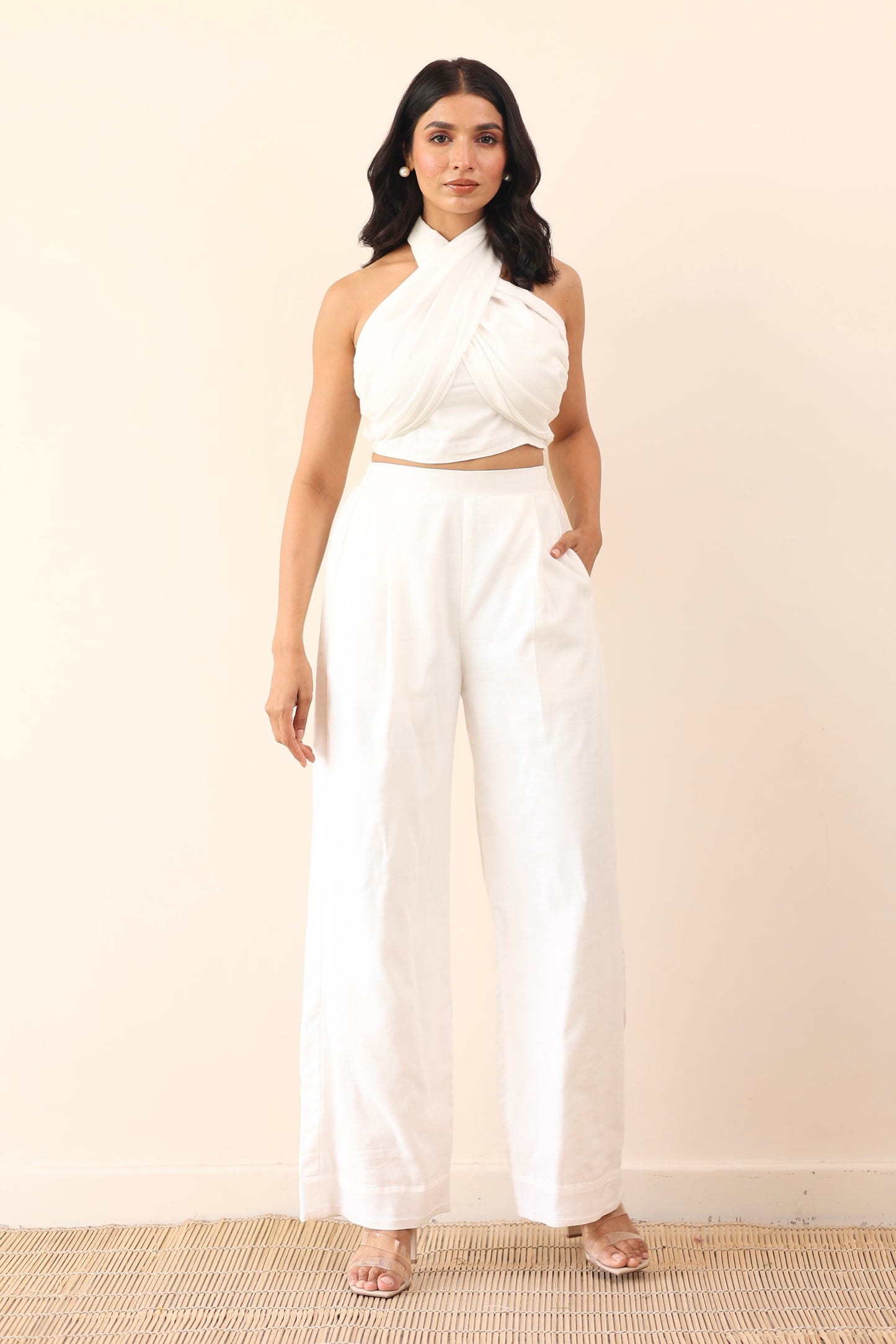 White high waist pants with tie up halter neck top