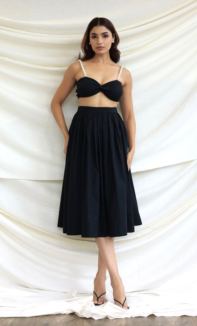 Black co-ord skirt and pearl bandeau top