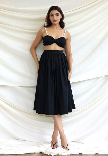 Black co-ord skirt and pearl bandeau top