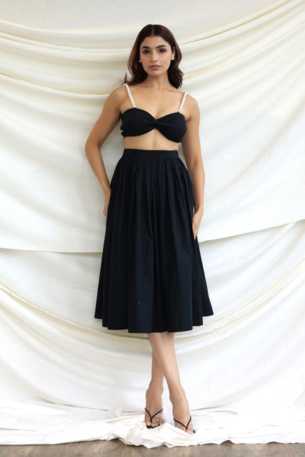 Black co-ord skirt and pearl bandeau top